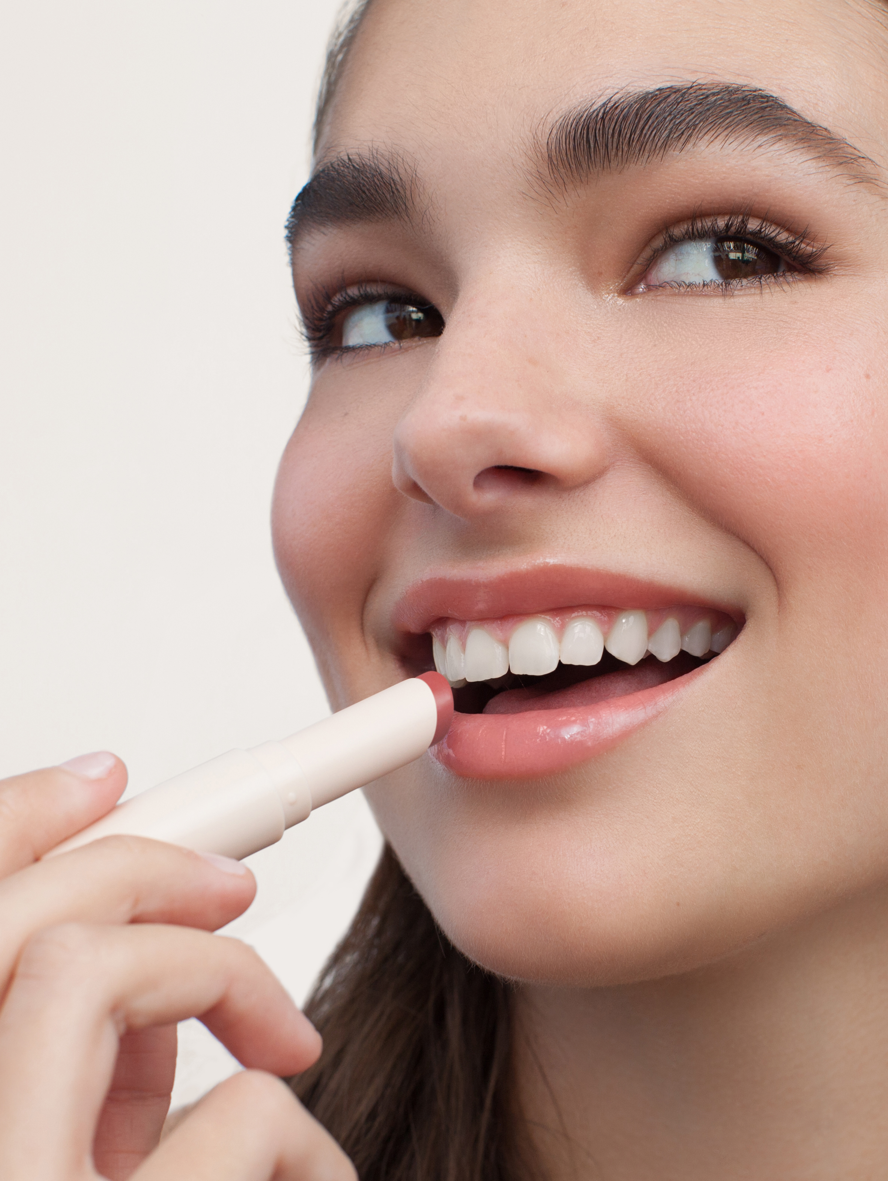 Jade wears Lip Treat in Sakura